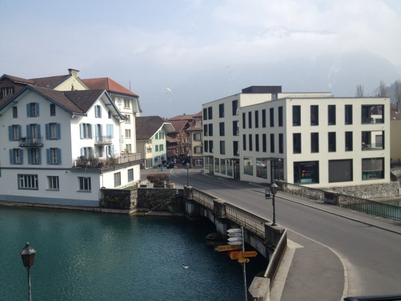 View from our Swiss Hotel Room, over the River Aare with Jungfrau and paragliders in the background
